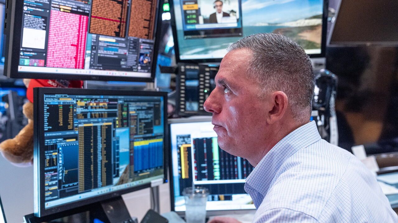 A trader works on the trading floor of the New York Stock Exchange