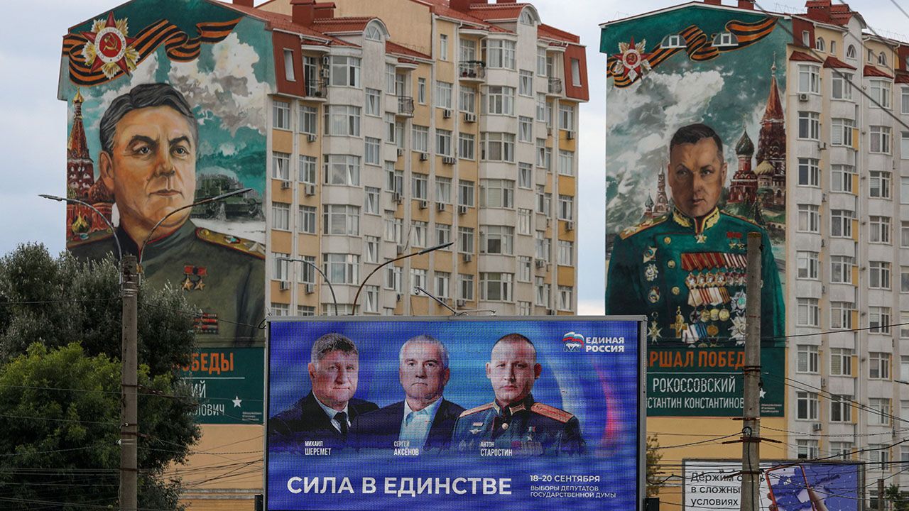 A screen promoting the United Russia party stands in front of residential buildings bearing murals of Soviet military commanders Konstantin Rokossovsky and Alexander Vasilevsky in Simferopol, Crimea, September 15th 2026