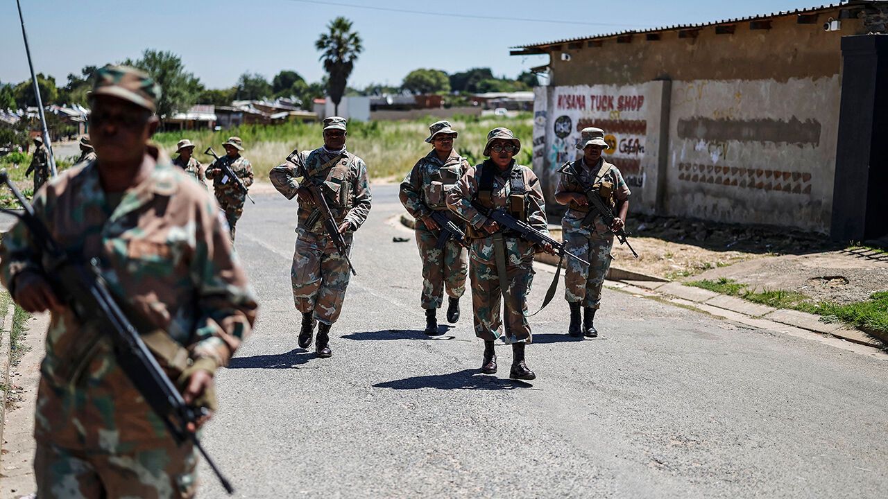 South African National Defence Force soldiers patrol near Johannesburg