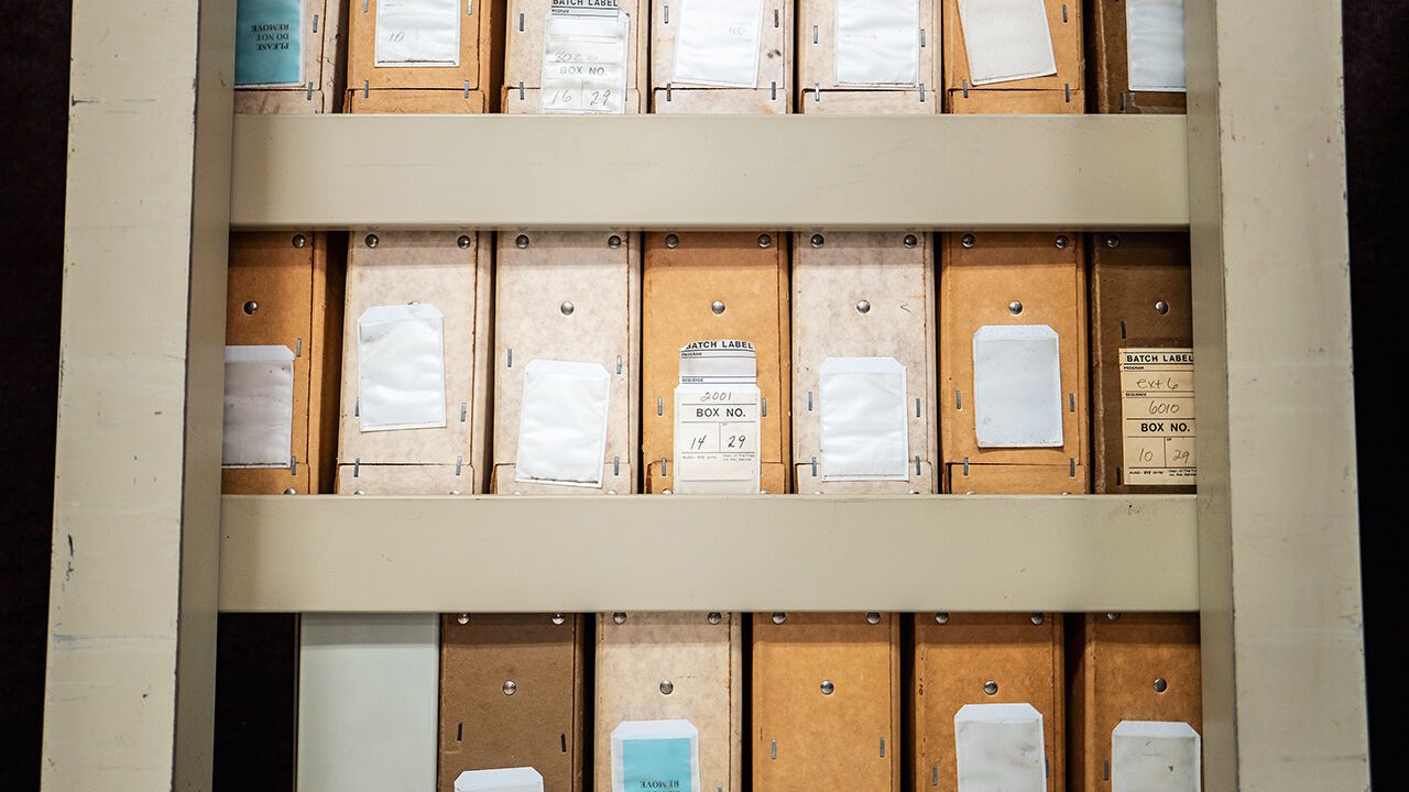 Carts containing documents sit organized at the IRS Processing Facility.