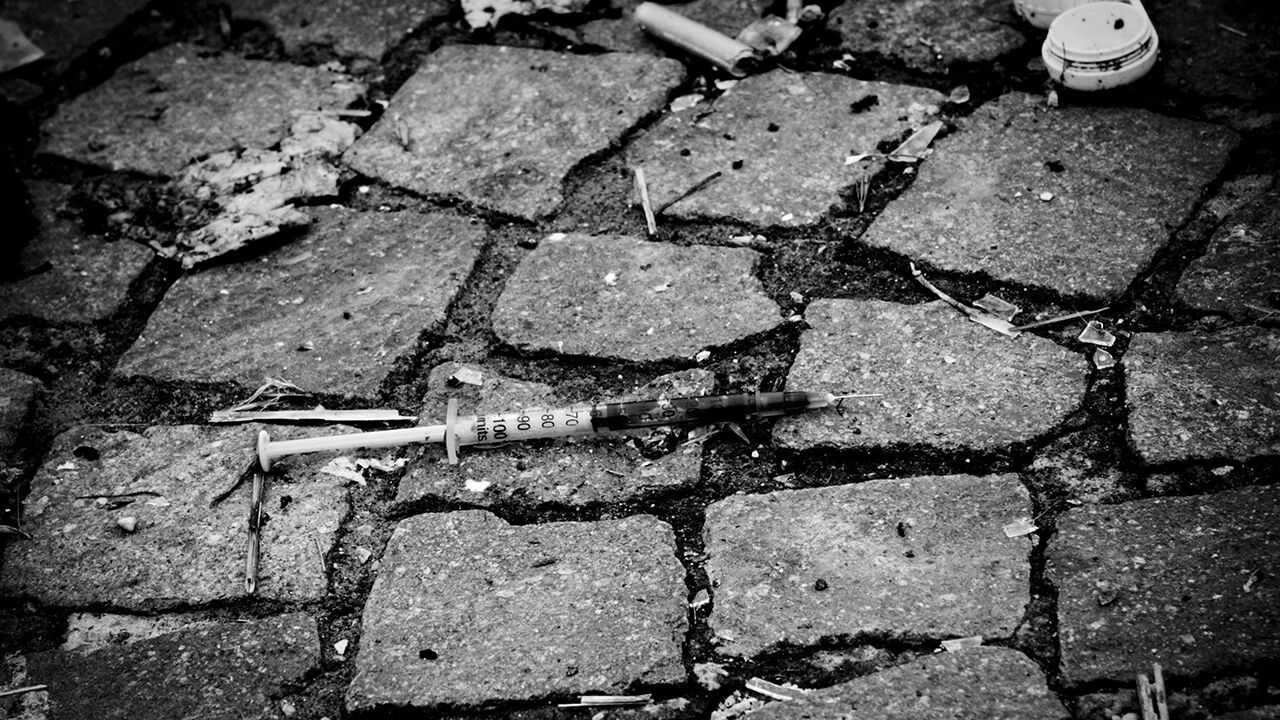 Syringes left on the floor of Scampia district, Naples, Italy