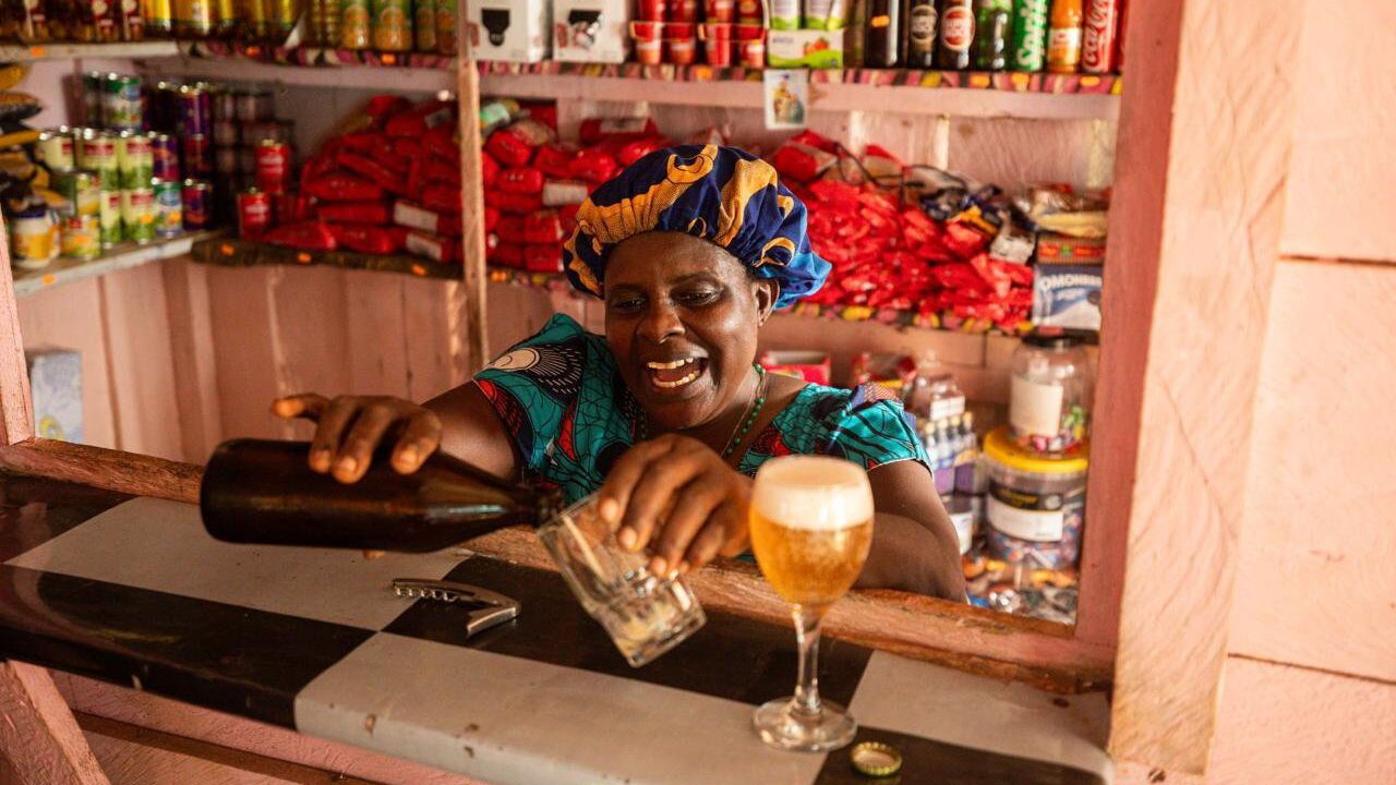 A bar owner pours a beer in Sao Tome