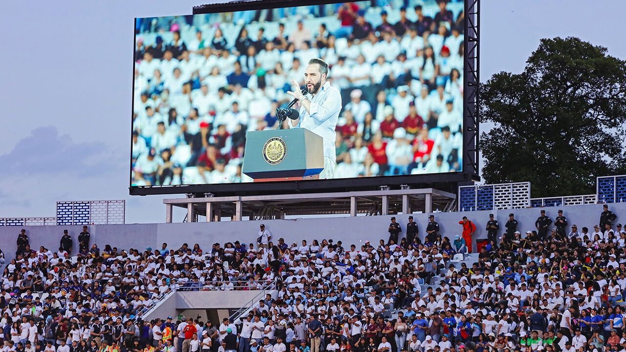 A view of a big screen in a stadium showing President Nayib Bukele of El Salvador .