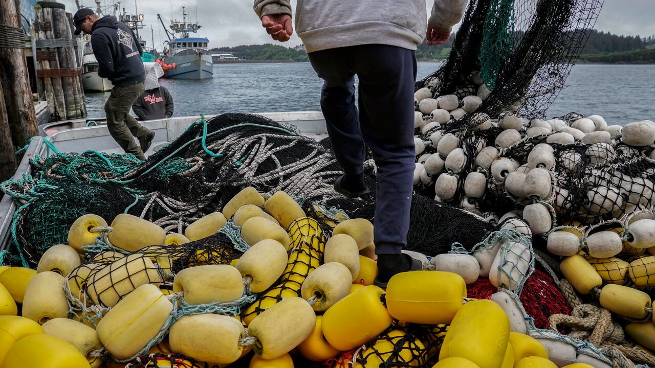 Fishermen on board a fishing boat in Kodiak, Alaska.