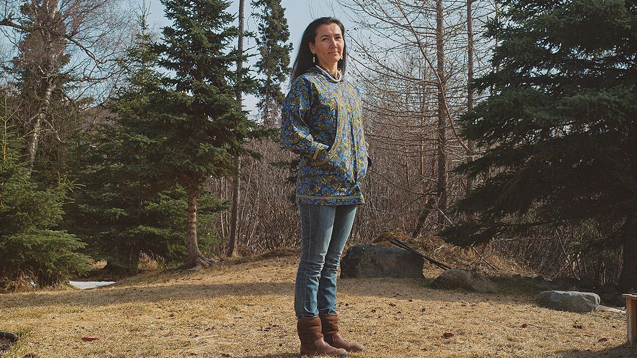 Portrait of Mary Peltola outside her home in Alaska.