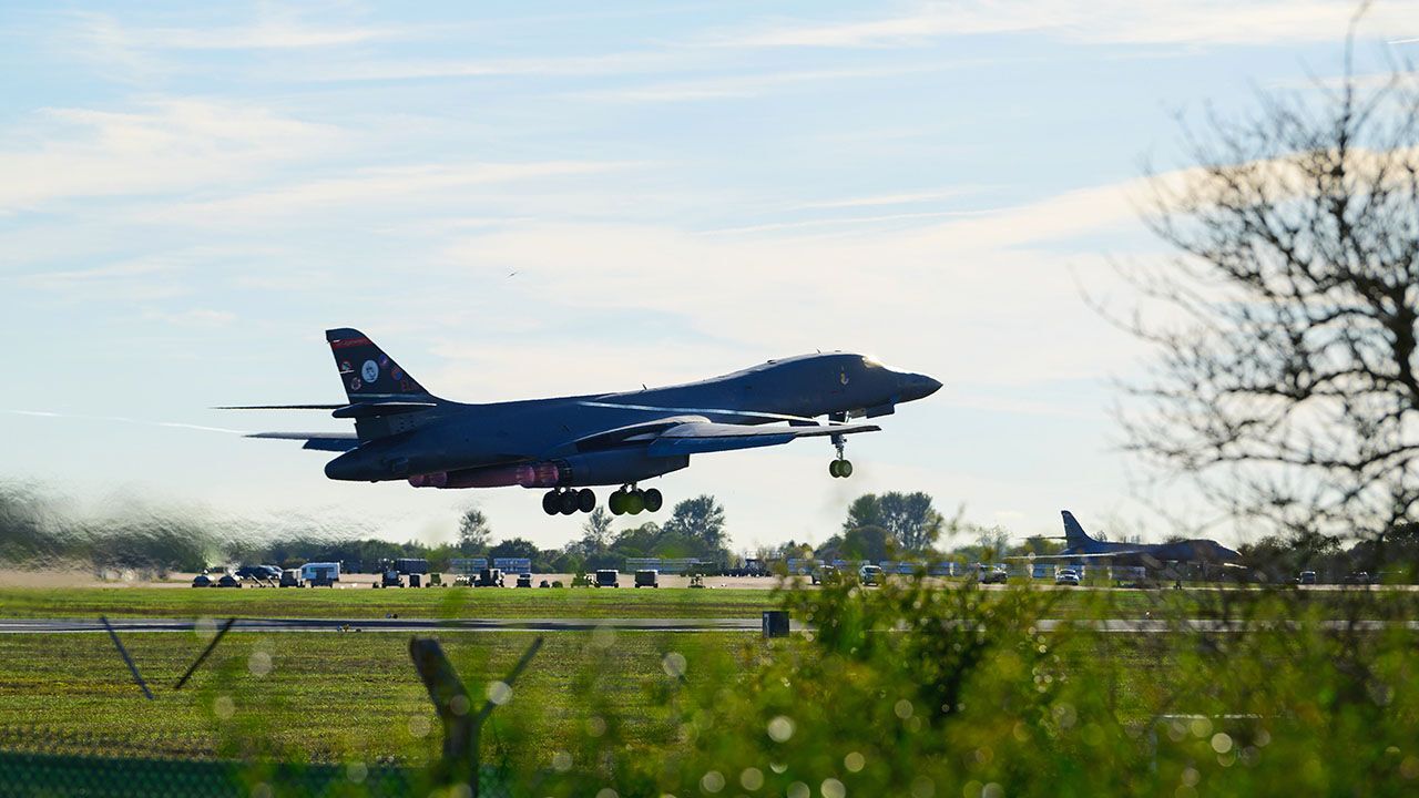 A Rockwell B1 Lancer heavy bomber takes off from runway 27 to depart for home at RAF Fairford