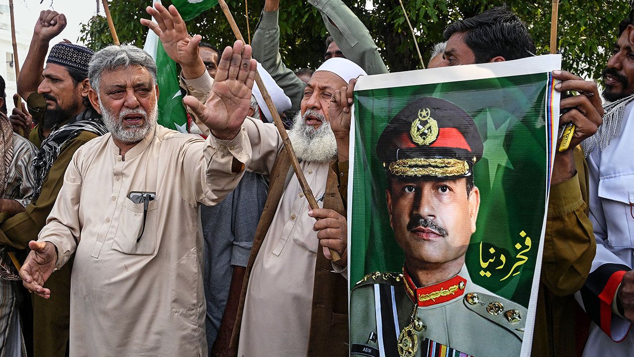 Pakistani's hold a poster of the Chief of Army Staff Field Marshal Asim Munir in Lahore