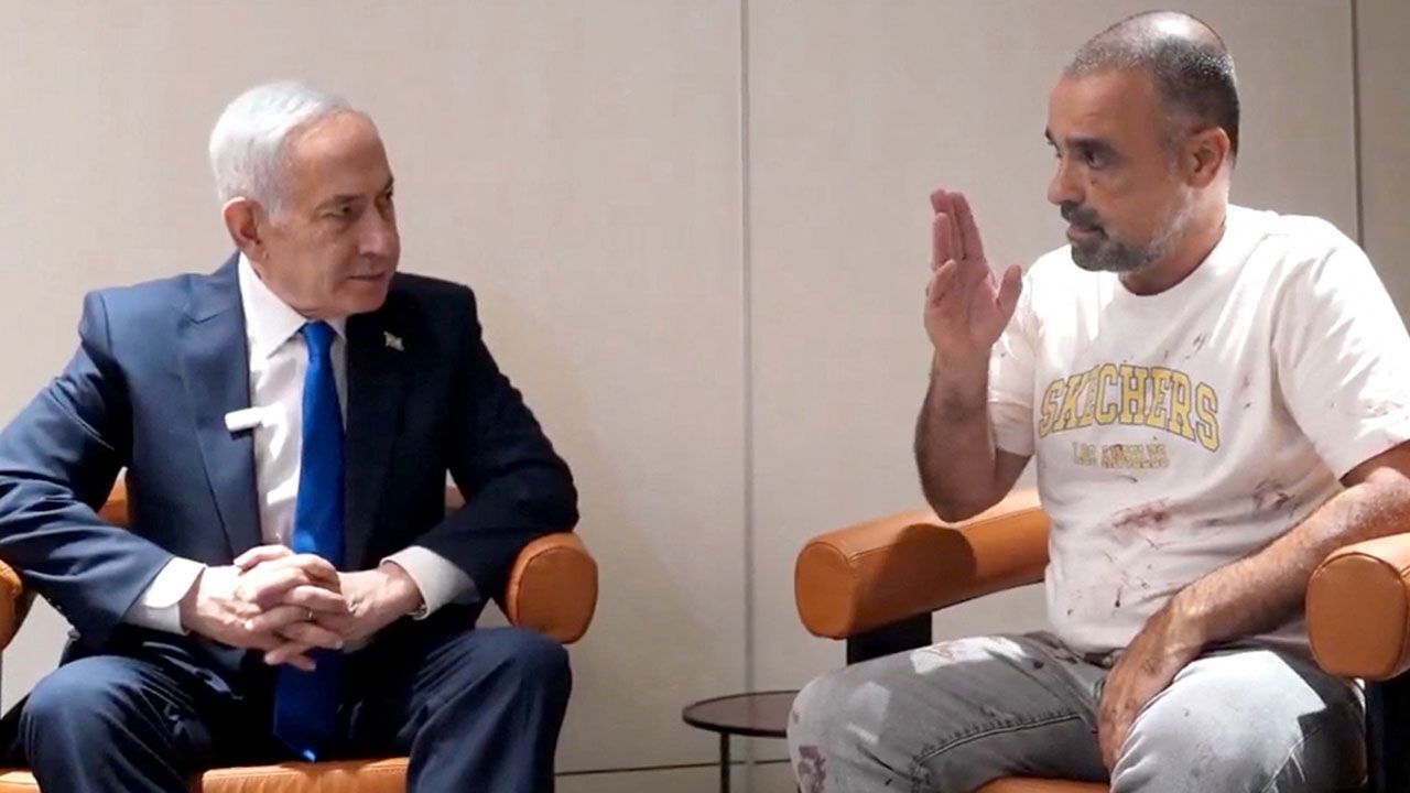 Israeli Prime Minister Benjamin Netanyahu meets Yaniv Hayun, a passenger on the FlyDubai flight