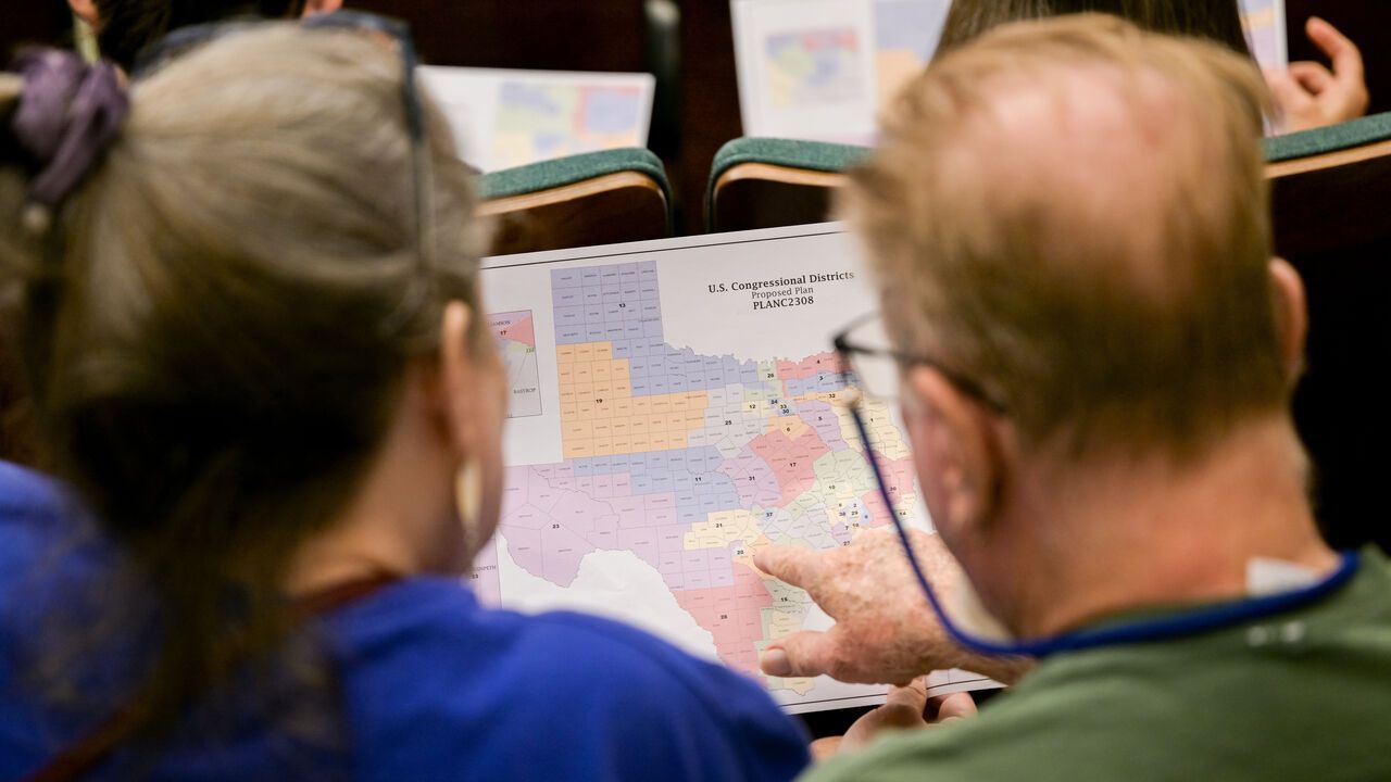 Attendees view a map during a Senate Special Committee on Congressional Redistricting public testimony hearing in Austin, Texas, USA.