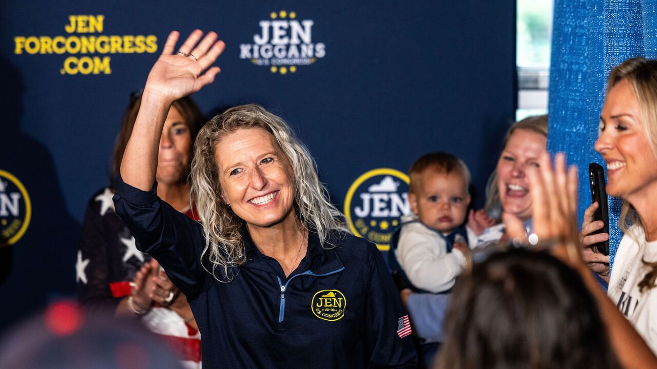 U.S Rep. Jen Kiggans waves to a crowd of supporters as she kicks off a campaign rally.