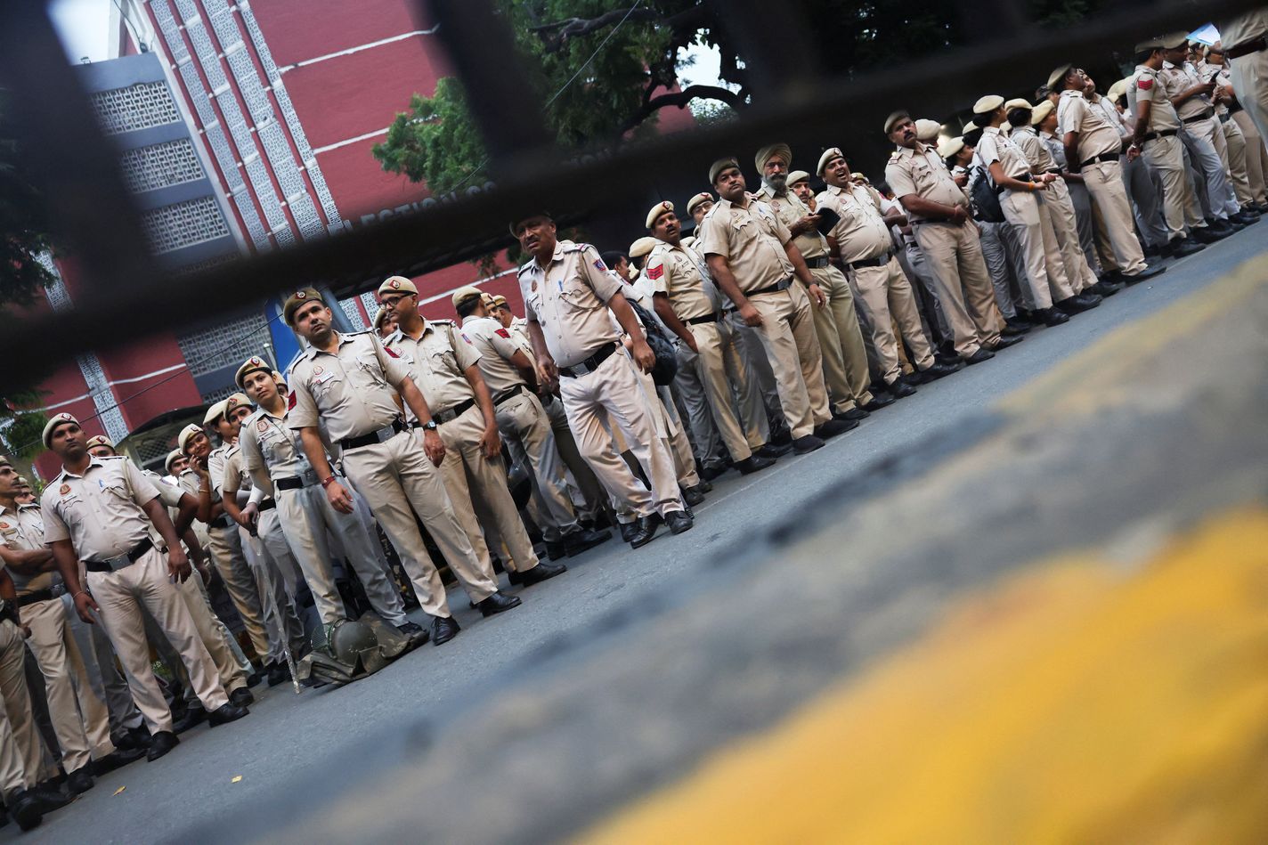 Security personnel stand guard outside the headquarters of the Election Commission of India on the day of a CJP protest