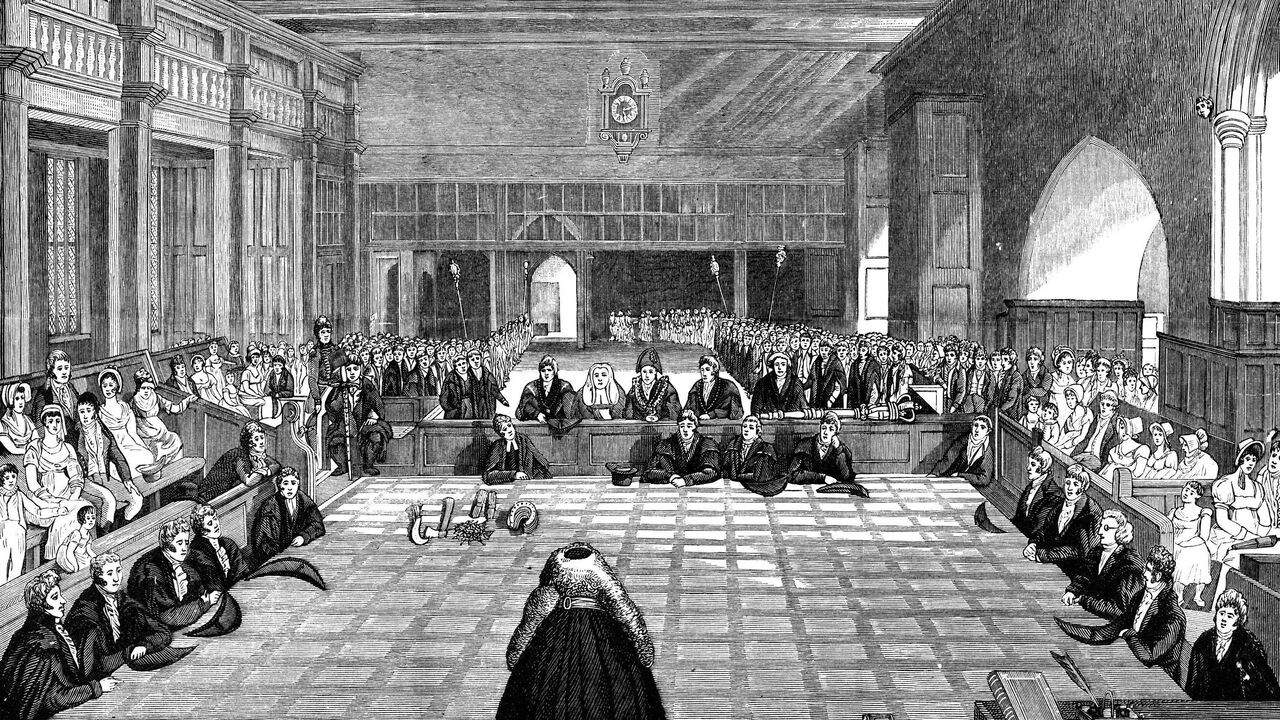 Presentation of horseshoes, nails and knives on a checkered cloth, to the Queens Remembrancer, during the ancient Quit Rents ceremony at Exchequer Court in London