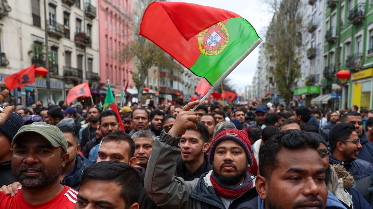 People demonstrate during the 'Don't let them put you up against the wall, march', in Lisbon, Portugal.