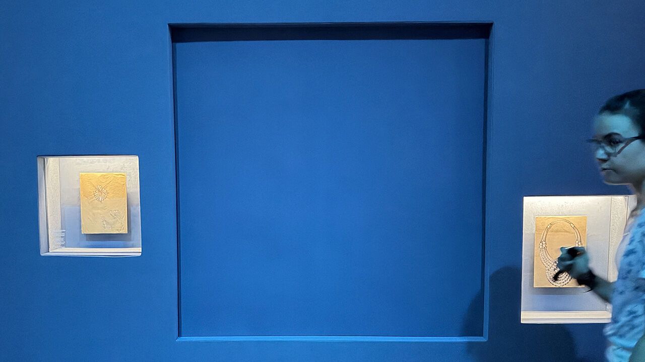 A blue panel covers the area where a display case was smashed and a Van Cleef and Arpels necklace was stolen at the Museum of Applied Arts (MAK), in Vienna, Austria