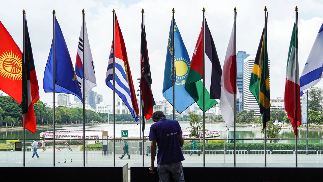 Thai workers put the finishing touches outside the Queen Sirikit National Convention Center in Bangkok ahead of the annual meetings of the International Monetary Fund and the World Bank Group.