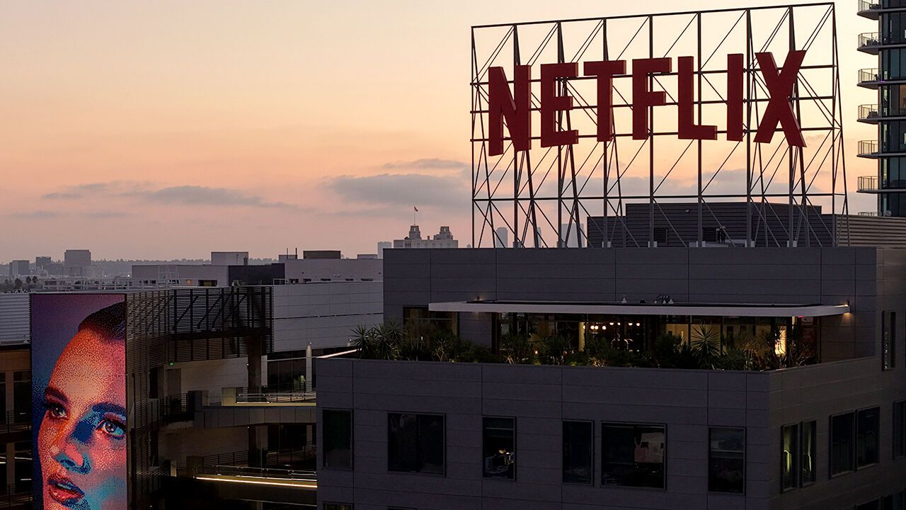 The Netflix logo is displayed above Netflix corporate offices in Los Angeles