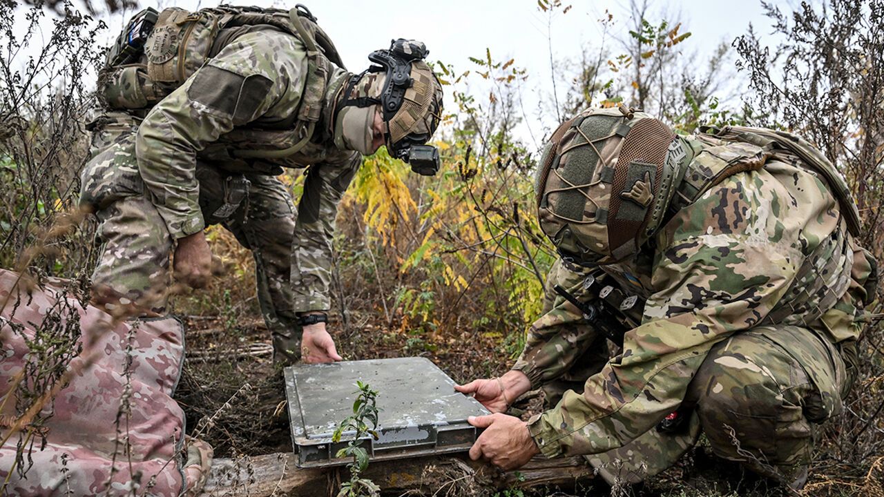 Soldiers from a separate task rifle battalion of the National Police of Ukraine in the Zaporizhzhia region set up a Starlink satellite communication terminal