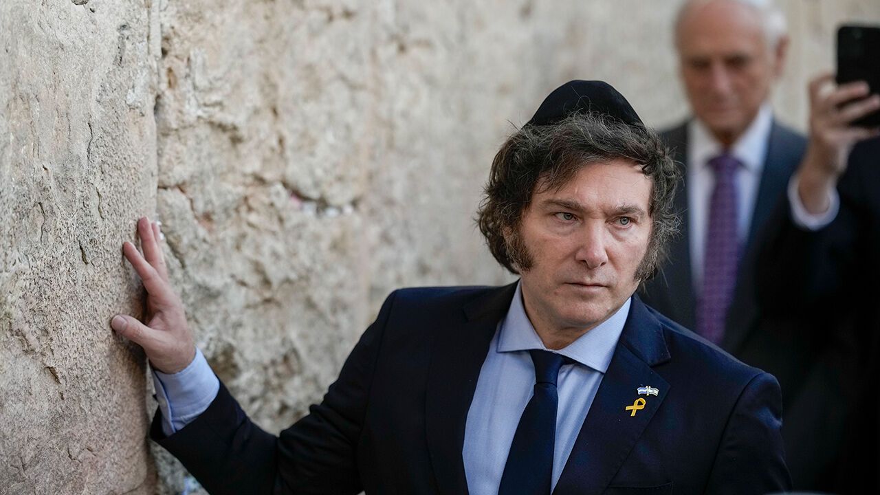 Argentine President Javier Milei touches the Western Wall in Jerusalem
