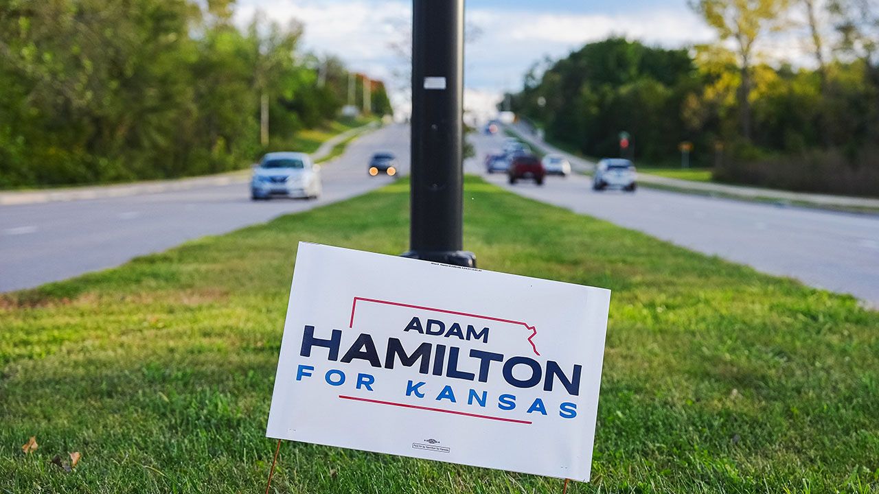 An Adam Hamilton for Kansas campaign yard sign.
