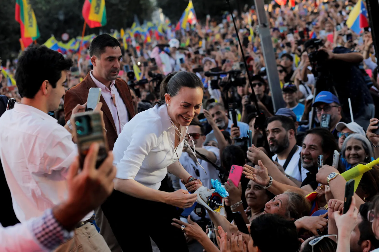 Venezuelan opposition leader and Nobel Peace Prize winner Maria Corina Machado greets supporters during an event to meet with members of Venezuela's community residing in Chile, in Santiago, Chile, March 12, 2026.