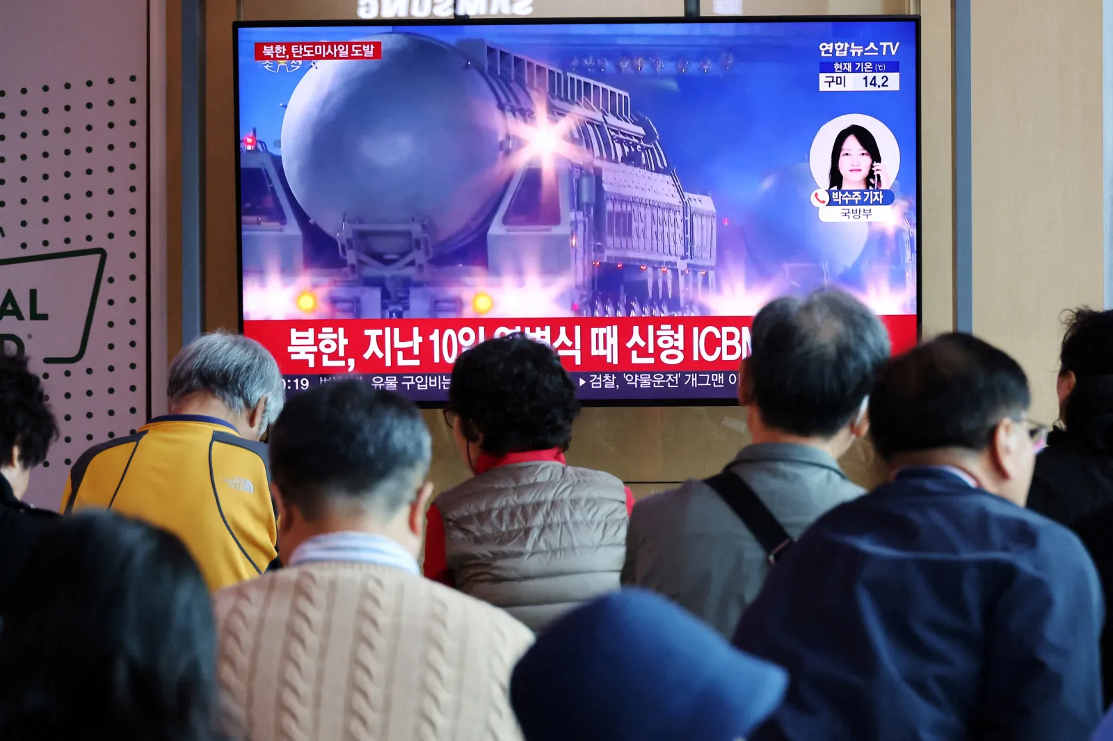 Watching news about North Korean missiles, Seoul, South Korea, October 2025